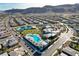 Community aerial view featuring a large pool, tennis courts, community center and numerous single-Gathering homes at 10001 Regency Square Ave, Las Vegas, NV 89148