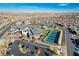 Aerial view of community featuring community center, multiple tennis courts, landscaping, and surrounding homes at 10001 Regency Square Ave, Las Vegas, NV 89148