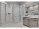 Modern bathroom features a glass-enclosed shower and a vanity with neutral tones and ample counter space at 10001 Regency Square Ave, Las Vegas, NV 89148