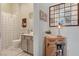 Bathroom showcasing vanity with neutral cabinetry and a mirror, complemented by stylish decor at 10001 Regency Square Ave, Las Vegas, NV 89148