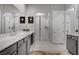 Bathroom featuring a dual sink vanity and glass shower at 10001 Regency Square Ave, Las Vegas, NV 89148