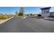 Community entrance with well-maintained landscaping and signage at 10001 Regency Square Ave, Las Vegas, NV 89148