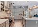 Gourmet kitchen with gray cabinetry, stainless steel appliances, and quartz countertops at 10001 Regency Square Ave, Las Vegas, NV 89148