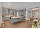 Bright kitchen features stylish gray cabinetry, modern lighting, stainless steel appliances, and a large center island at 10001 Regency Square Ave, Las Vegas, NV 89148