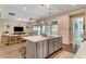 Bright open kitchen with a large island, stainless steel appliances, and modern finishes at 10001 Regency Square Ave, Las Vegas, NV 89148