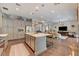 Open-concept kitchen with stainless steel appliances and large island at 10001 Regency Square Ave, Las Vegas, NV 89148