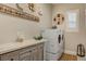 Well-organized laundry room features modern washer/dryer, countertop, and stylish decor at 10001 Regency Square Ave, Las Vegas, NV 89148