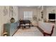 Sitting room with decorative rug and an upright piano at 10001 Regency Square Ave, Las Vegas, NV 89148