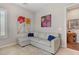 Cozy living room features a comfortable gray sofa, stylish artwork, and an open doorway at 10001 Regency Square Ave, Las Vegas, NV 89148