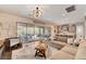 Comfortable living room with modern decor, shiplap wall, and sliding doors to the patio at 10001 Regency Square Ave, Las Vegas, NV 89148