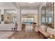 A bright and open living room with wood floors and a view of the seating area and open concept kitchen at 10001 Regency Square Ave, Las Vegas, NV 89148