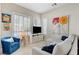 Bright and airy living room with shutters, comfortable seating, and stylish decor at 10001 Regency Square Ave, Las Vegas, NV 89148