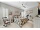 Comfortable bedroom with a ceiling fan and natural light at 10001 Regency Square Ave, Las Vegas, NV 89148