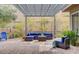 Stylish outdoor patio with comfortable seating and a decorative pergola for shade at 10001 Regency Square Ave, Las Vegas, NV 89148