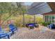 Relaxing patio with Adirondack chairs, perfect for outdoor enjoyment at 10001 Regency Square Ave, Las Vegas, NV 89148