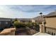 Balcony view of neighborhood with green trees and mountain views at 10075 Cranbrook Falls Ct, Las Vegas, NV 89148