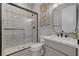 Bathroom features a glass enclosed shower, unique tile accent and modern vanity with black hardware at 10197 Copper Meadow Ave, Las Vegas, NV 89166