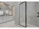 Modern bathroom with a glass shower enclosure, dual sinks, and elegant tiling at 10197 Copper Meadow Ave, Las Vegas, NV 89166