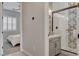 Stylish bathroom showcasing a glass-enclosed shower with decorative tile accent wall and modern vanity at 10197 Copper Meadow Ave, Las Vegas, NV 89166