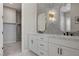 Stylish bathroom with dual sinks, elegant mirrors, and modern fixtures at 10197 Copper Meadow Ave, Las Vegas, NV 89166