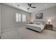 Serene bedroom with neutral colors, plush carpeting, and a ceiling fan at 10197 Copper Meadow Ave, Las Vegas, NV 89166