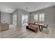 Dining area with a wooden table, bench seating, and sliding doors to the outdoor patio at 10197 Copper Meadow Ave, Las Vegas, NV 89166