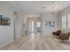 Bright entryway featuring modern decor, light wood floors, and access to other rooms at 10197 Copper Meadow Ave, Las Vegas, NV 89166
