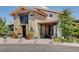 Stone and stucco community building with tile roof and manicured landscaping at 10197 Copper Meadow Ave, Las Vegas, NV 89166