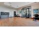 Bright workout room with wood floors, exercise bikes, and mirrored wall at 10197 Copper Meadow Ave, Las Vegas, NV 89166