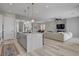 Open layout of the kitchen and living room with a kitchen island and stainless steel appliances at 10197 Copper Meadow Ave, Las Vegas, NV 89166
