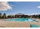 Community swimming pool with lounge chairs surrounded by well-maintained landscaping at 10197 Copper Meadow Ave, Las Vegas, NV 89166