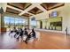 Well-lit workout room with exercise bikes, hardwood floors, and large wall mirror at 10197 Copper Meadow Ave, Las Vegas, NV 89166