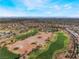 Expansive aerial view of a beautiful golf course winding through a residential community at 10508 Snyder Ave, Las Vegas, NV 89134
