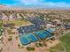 Community aerial showcasing recreation center, tennis courts, community pool, and mature landscaping at 10508 Snyder Ave, Las Vegas, NV 89134