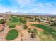 Stunning aerial view of the community golf course showing meticulously manicured greens and beautiful landscaping at 10508 Snyder Ave, Las Vegas, NV 89134