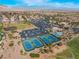 Aerial view of the community with tennis courts, baseball field, clubhouse, and parking at 10508 Snyder Ave, Las Vegas, NV 89134