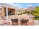 Charming backyard showcasing a pergola, stone patio, and low-maintenance landscaping for relaxed outdoor enjoyment at 10508 Snyder Ave, Las Vegas, NV 89134