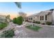 Beautifully landscaped backyard with custom hardscape and desert-friendly greenery for easy maintenance at 10508 Snyder Ave, Las Vegas, NV 89134