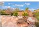 Relaxing backyard featuring desert landscaping, custom hardscape, and comfortable lounge chairs for outdoor enjoyment at 10508 Snyder Ave, Las Vegas, NV 89134