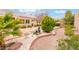 Serene backyard oasis with a tranquil water feature, mature plants, and easy-care landscaping at 10508 Snyder Ave, Las Vegas, NV 89134