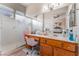 Bright bathroom with a vanity, sink, and glass-enclosed shower at 10508 Snyder Ave, Las Vegas, NV 89134