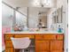 Bright bathroom with a vanity, sink, and glass-enclosed shower at 10508 Snyder Ave, Las Vegas, NV 89134