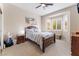 Serene bedroom with carpeted flooring, a ceiling fan, and a bay window with privacy shutters at 10508 Snyder Ave, Las Vegas, NV 89134