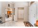 Welcoming foyer with tile flooring, high ceilings, and a view into the adjacent dining area at 10508 Snyder Ave, Las Vegas, NV 89134