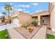 Inviting front yard featuring desert-style landscaping, drought-tolerant plants, and a paved walkway to the entrance at 10508 Snyder Ave, Las Vegas, NV 89134