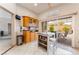 Bright kitchen boasts an island with bar seating and access to the backyard patio at 10508 Snyder Ave, Las Vegas, NV 89134