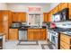 Functional kitchen featuring stainless steel appliances, wooden cabinets, and granite countertops at 10508 Snyder Ave, Las Vegas, NV 89134