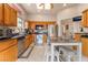 Functional kitchen design with stainless steel appliances, tile floors, and convenient kitchen island at 10508 Snyder Ave, Las Vegas, NV 89134