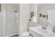 Bathroom with white shower, single sink vanity, and decor that creates a calm, inviting space at 10548 Nantucket Ridge Ave, Las Vegas, NV 89166