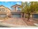 Charming two-story home with a paver driveway and a well-manicured front yard, perfect for Gathering living at 10548 Nantucket Ridge Ave, Las Vegas, NV 89166